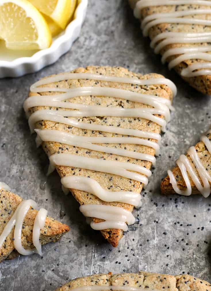 These Paleo Lemon Poppy Seed Scones are light, fresh and so delicious! A great summer dessert that is gluten free, dairy free and naturally sweetened.