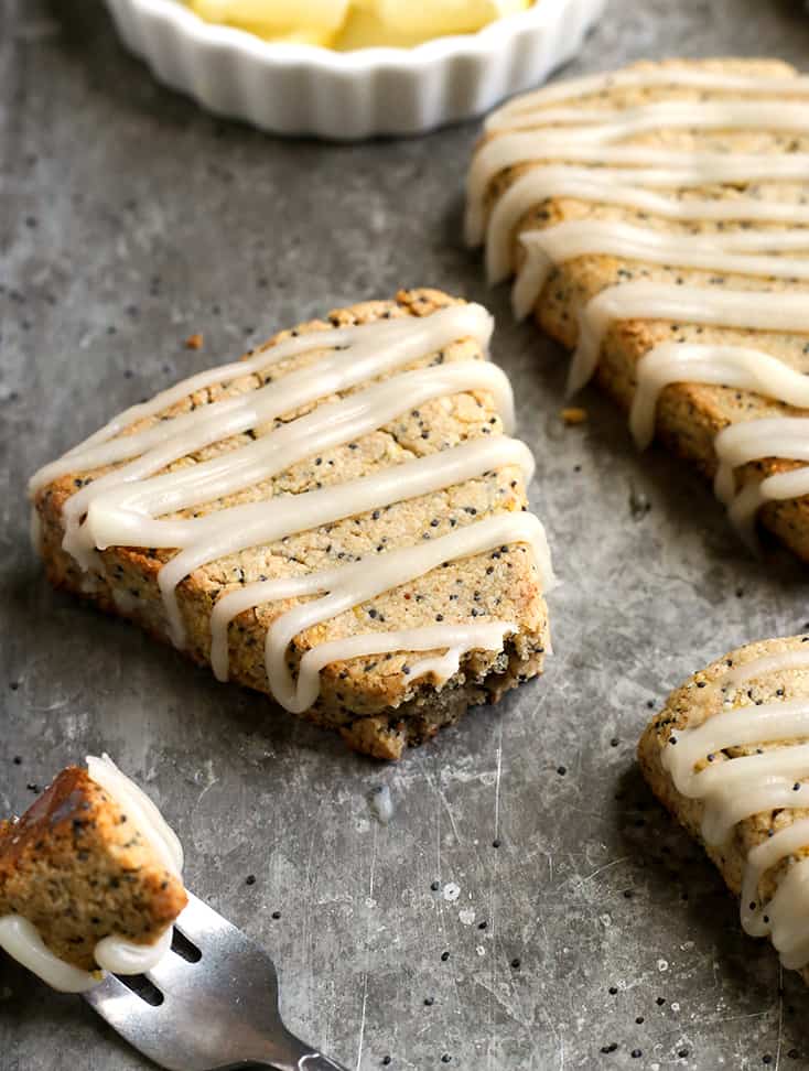 These Paleo Lemon Poppy Seed Scones are light, fresh and so delicious! A great summer dessert that is gluten free, dairy free and naturally sweetened.