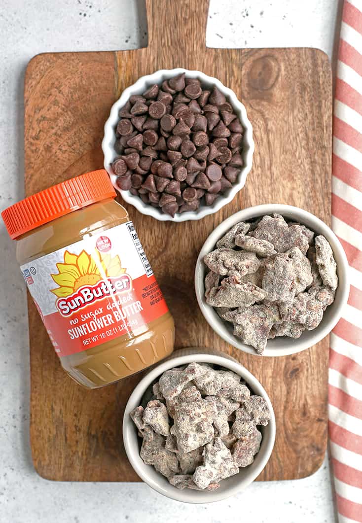 These Paleo Nut-Free Muddy Buddies (also known as Puppy Chow) are easy to make and so delicious. A chocolate and SunButter mixture poured over sunflower seeds and dusted with maple sugar. They are gluten free, dairy free, vegan, and naturally sweetened.