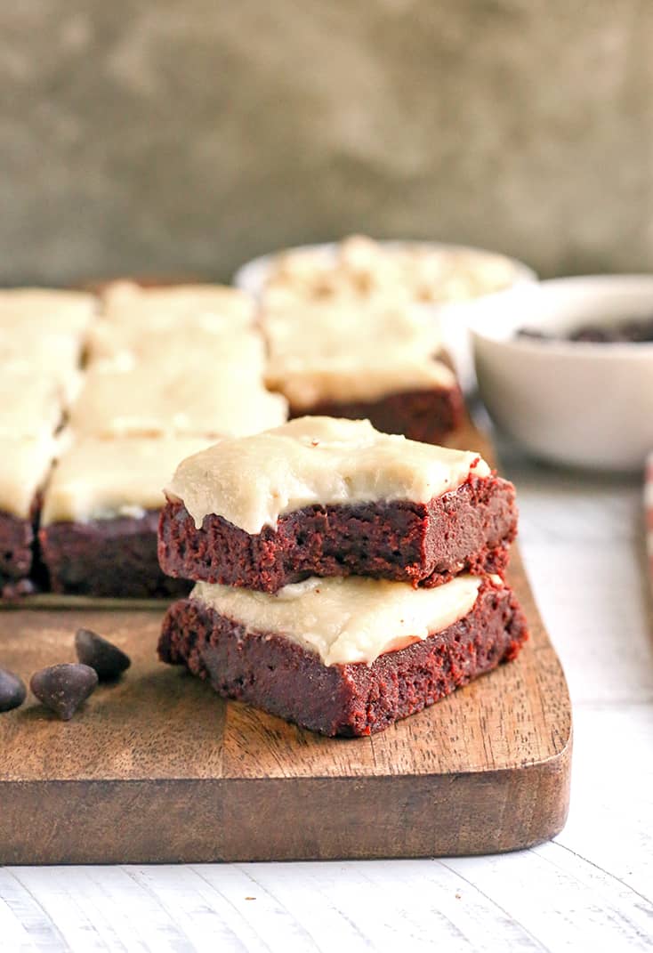 These Paleo Red Velvet Brownies are rich and have a sweet dairy free cheesecake topping. They are so delicious and gluten free, dairy free, naturally sweetened with a nut free option.