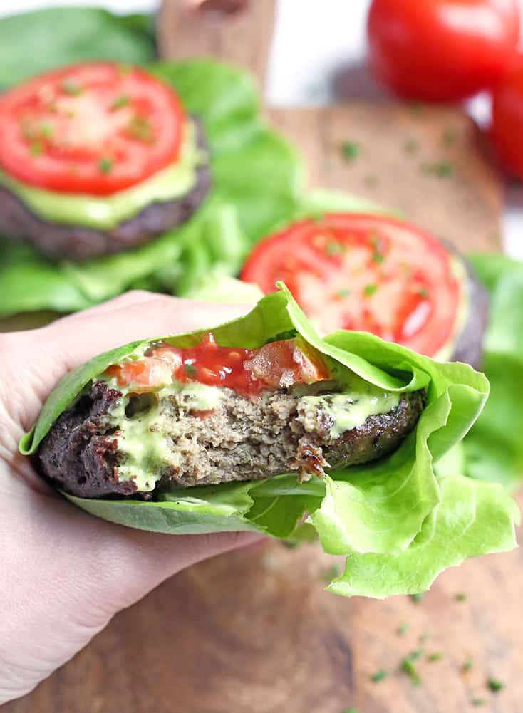 These Paleo Whole30 Pesto Turkey Burgers are easy to make and so delicious! A simple pesto gets mixed with the meat and they are grilled to perfection. Gluten free, dairy free, low carb and low FODMAP.