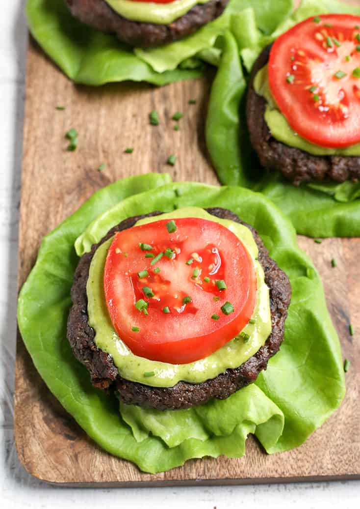 These Paleo Whole30 Pesto Turkey Burgers are easy to make and so delicious! A simple pesto gets mixed with the meat and they are grilled to perfection. Gluten free, dairy free, low carb and low FODMAP.