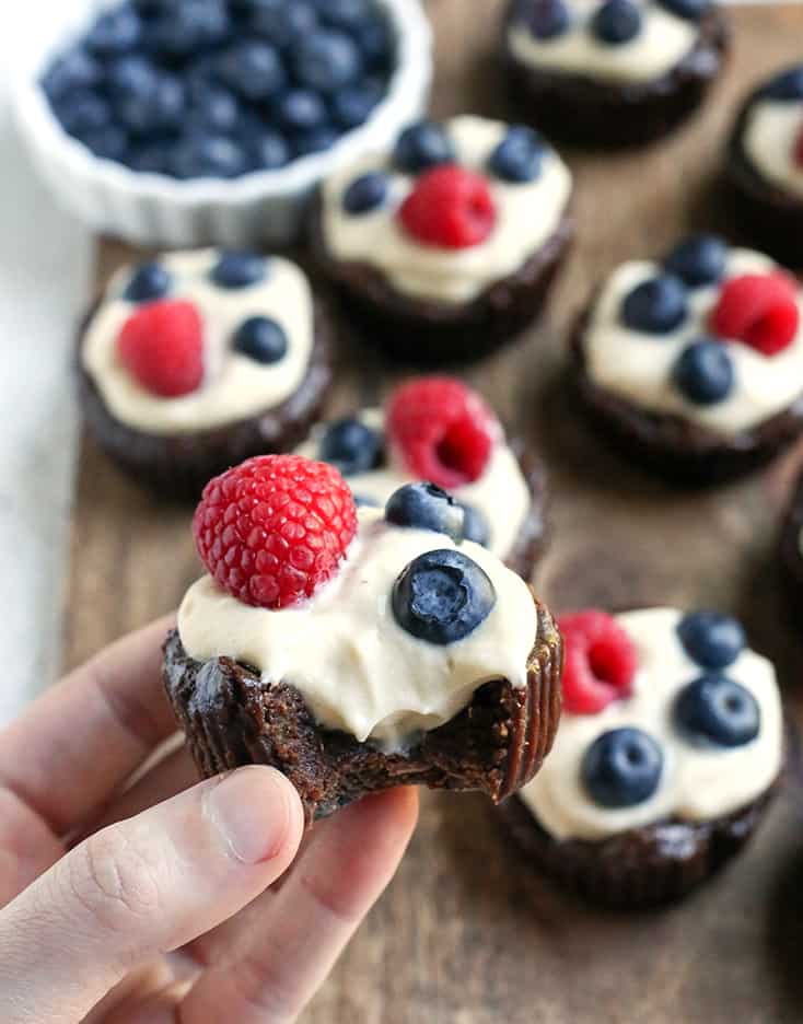These Paleo Pudding Filled Brownie Bites are such a fun dessert. An easy brownie is made in a muffin pan and filled with dairy free pudding and topped with berries. They're dairy free, gluten free, low FODMAP, and naturally sweetened.