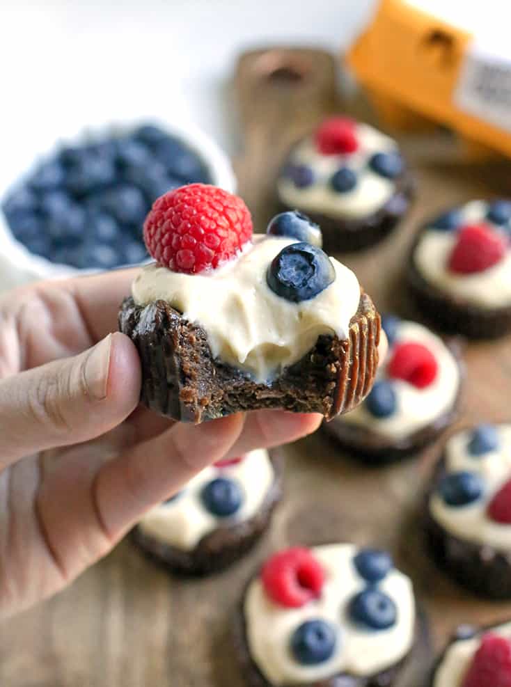 These Paleo Pudding Filled Brownie Bites are such a fun dessert. An easy brownie is made in a muffin pan and filled with dairy free pudding and topped with berries. They're dairy free, gluten free, low FODMAP, and naturally sweetened.