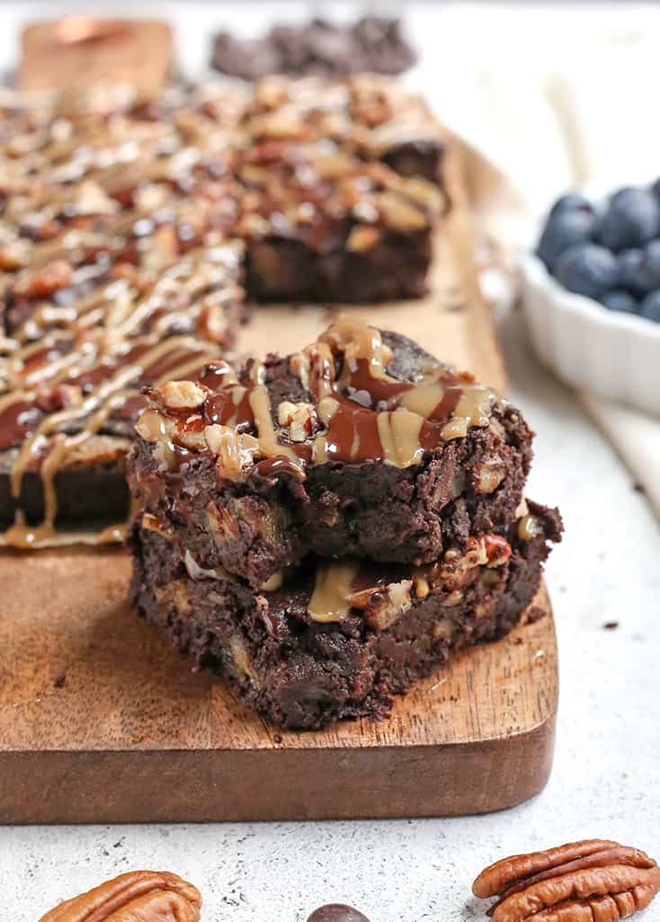 These Paleo Turtle Brownies have a rich, chocolate base, layered with caramel, topped with pecans and chocolate chips and drizzled with more caramel. A decadent treat that is gluten free, dairy free, and low FODMAP.