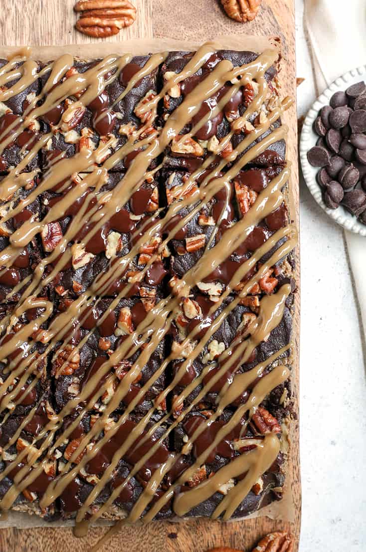 These Paleo Turtle Brownies have a rich, chocolate base, layered with caramel, topped with pecans and chocolate chips and drizzled with more caramel. A decadent treat that is gluten free, dairy free, and low FODMAP.