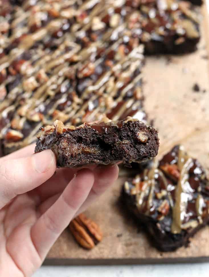 These Paleo Turtle Brownies have a rich, chocolate base, layered with caramel, topped with pecans and chocolate chips and drizzled with more caramel. A decadent treat that is gluten free, dairy free, and low FODMAP.