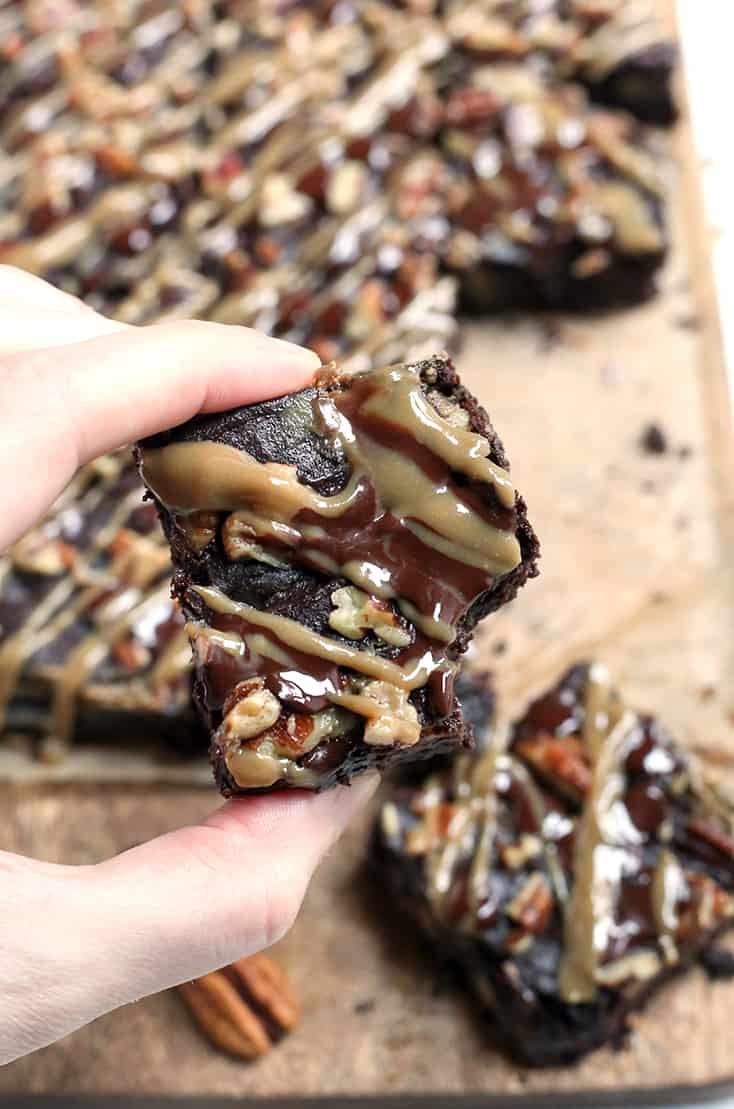 These Paleo Turtle Brownies have a rich, chocolate base, layered with caramel, topped with pecans and chocolate chips and drizzled with more caramel. A decadent treat that is gluten free, dairy free, and low FODMAP.