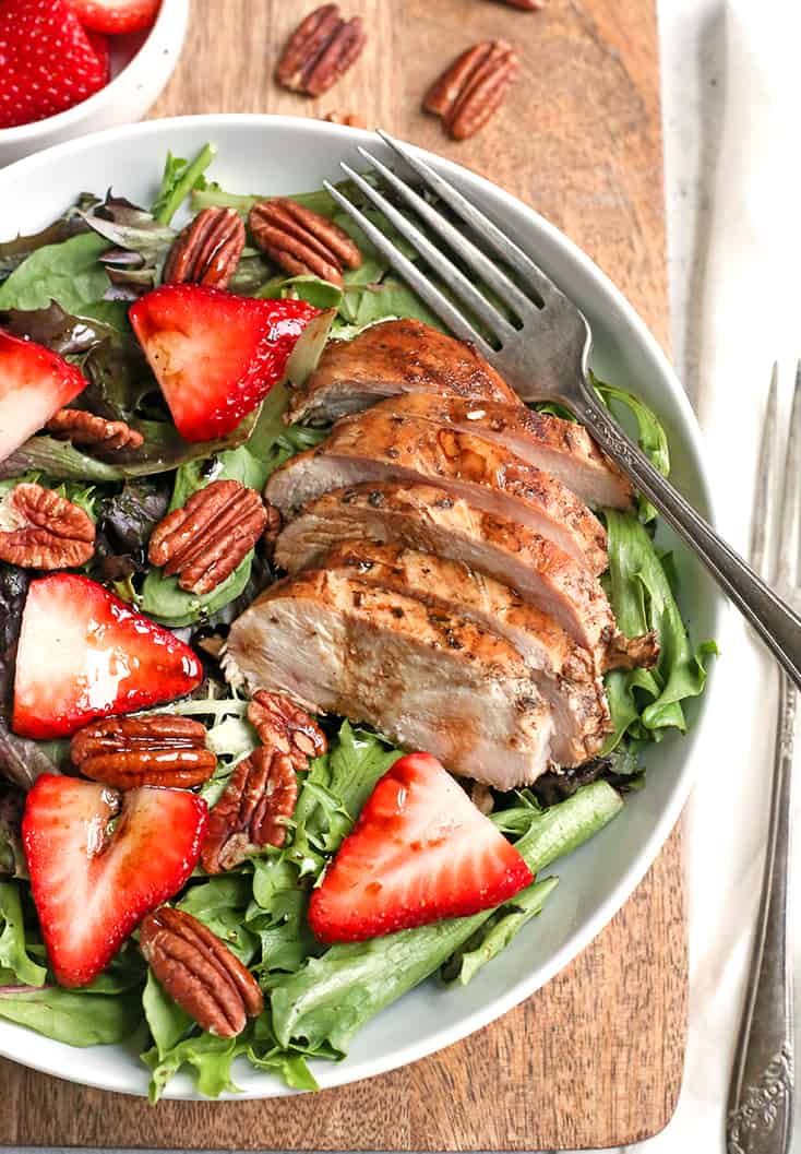 This Paleo Whole30 Balsamic Chicken Strawberry Salad is an easy meal filled with fresh berries and flavorful chicken. A homemade dressing that doubles as the marinade keeps it simple. It's gluten free, dairy free, and low FODMAP.