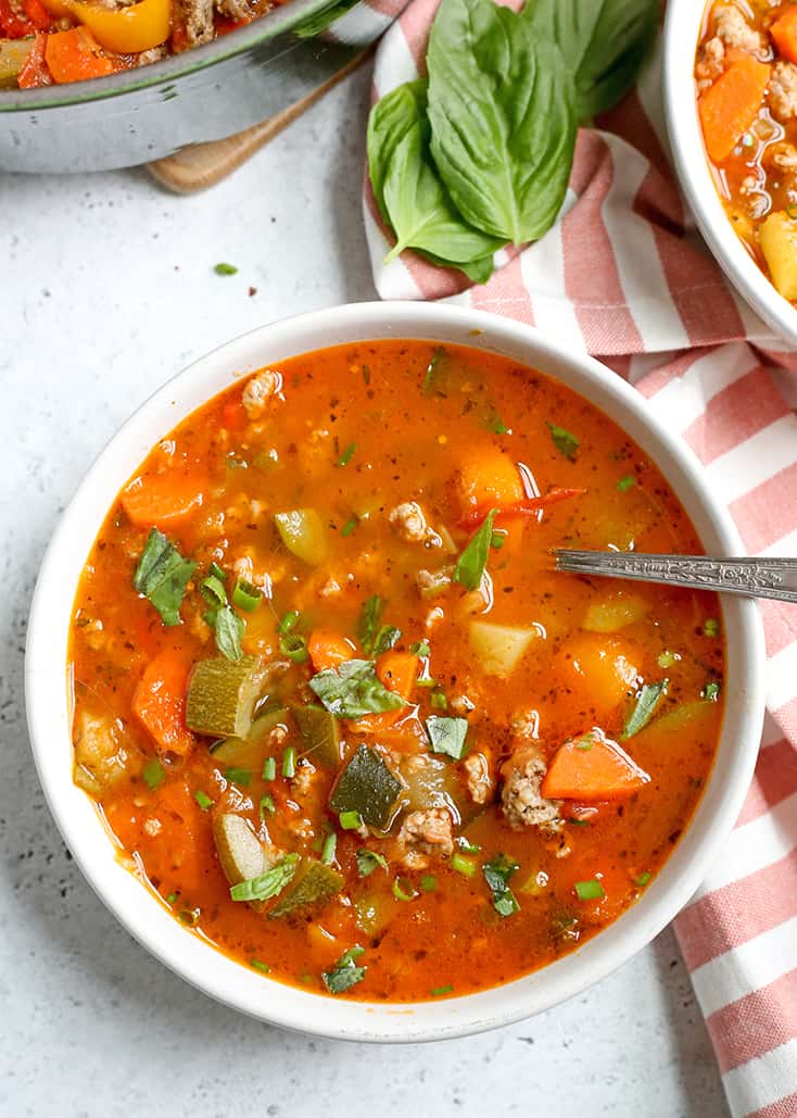 This Paleo Whole30 Sausage Summer Vegetable Soup is easy to make and great for using all the summer veggies. Hearty, tasty, and healthy. Gluten free, dairy free, and low FODMAP.