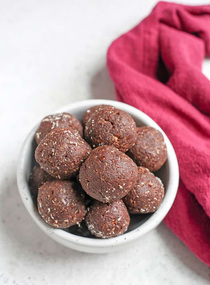 These Paleo German Chocolate Bites are easy to make and so delicious! Toasted coconut, pecans, chocolate and dates combine to make a simple treat. They are vegan, gluten free, dairy free and Whole30.