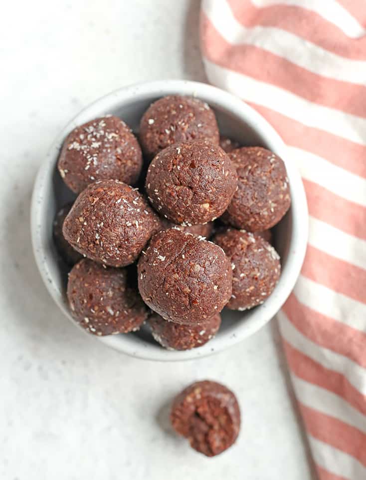 These Paleo German Chocolate Bites are easy to make and so delicious! Toasted coconut, pecans, chocolate and dates combine to make a simple treat. They are vegan, gluten free, dairy free and Whole30.