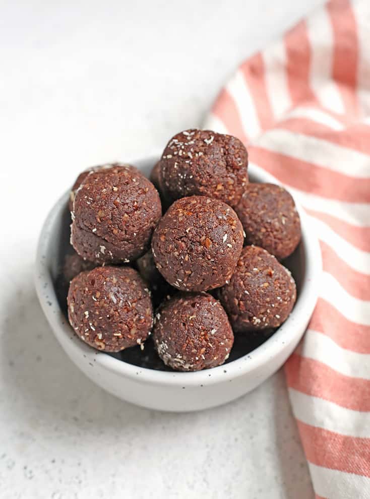 These Paleo German Chocolate Bites are easy to make and so delicious! Toasted coconut, pecans, chocolate and dates combine to make a simple treat. They are vegan, gluten free, dairy free and Whole30.