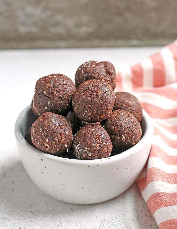 These Paleo German Chocolate Bites are easy to make and so delicious! Toasted coconut, pecans, chocolate and dates combine to make a simple treat. They are vegan, gluten free, dairy free and Whole30.