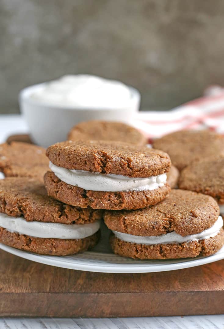 These Paleo Oatmeal Cream Pies contain no oatmeal, but still have the same taste and texture. A soft, sweet cookie with a marshmallow filling. Gluten free, dairy free, and naturally sweetened.