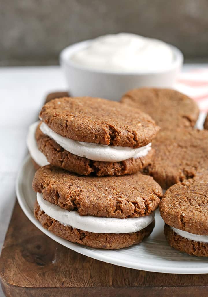 These Paleo Oatmeal Cream Pies contain no oatmeal, but still have the same taste and texture. A soft, sweet cookie with a marshmallow filling. Gluten free, dairy free, and naturally sweetened.