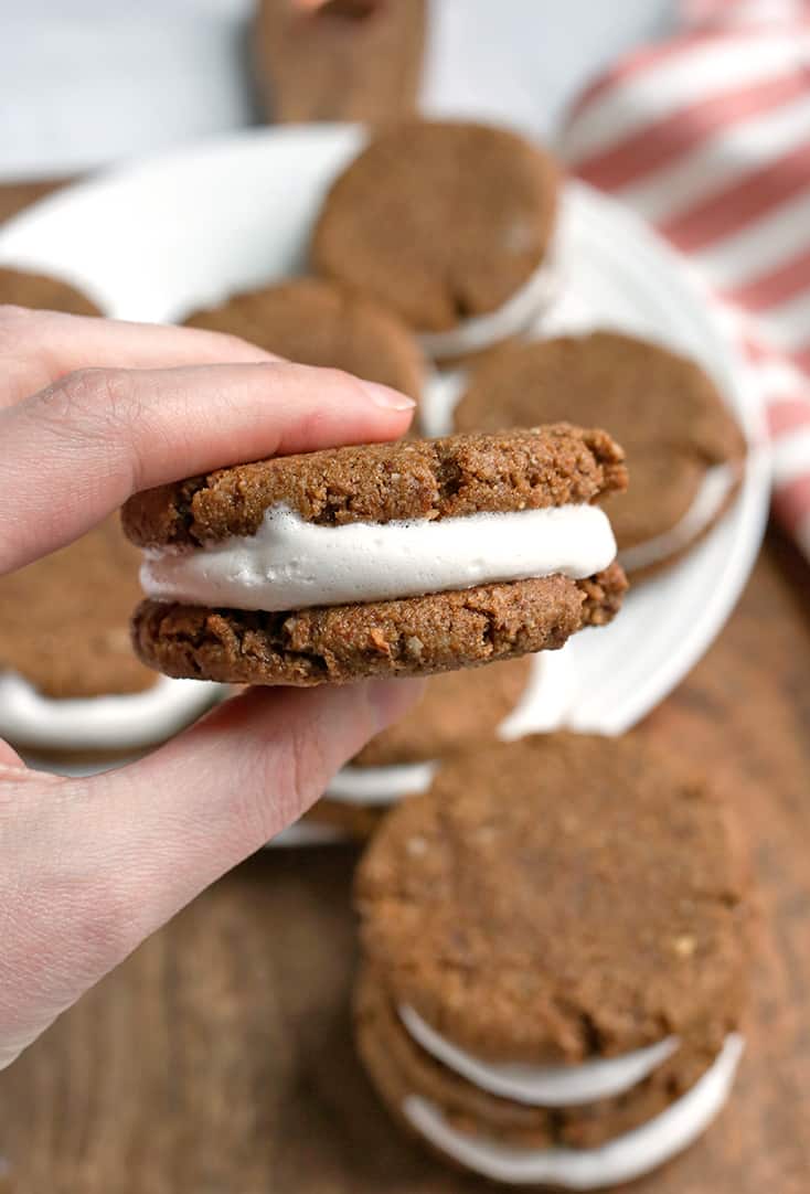 These Paleo Oatmeal Cream Pies contain no oatmeal, but still have the same taste and texture. A soft, sweet cookie with a marshmallow filling. Gluten free, dairy free, and naturally sweetened.