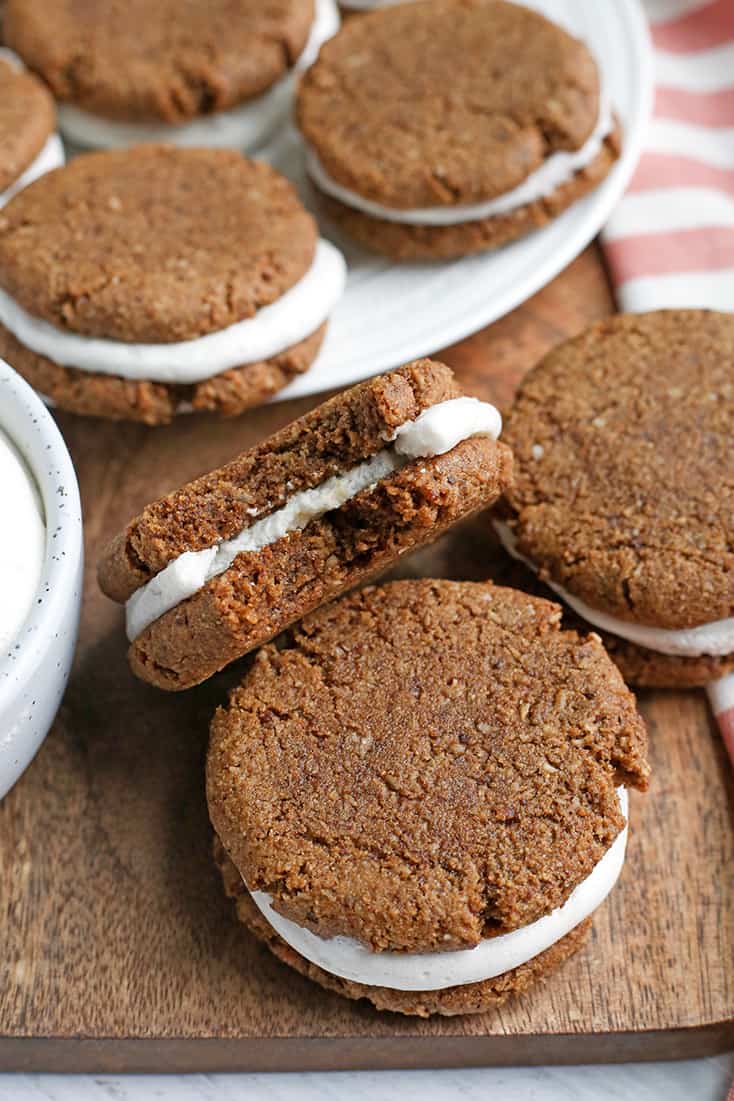 These Paleo Oatmeal Cream Pies contain no oatmeal, but still have the same taste and texture. A soft, sweet cookie with a marshmallow filling. Gluten free, dairy free, and naturally sweetened.