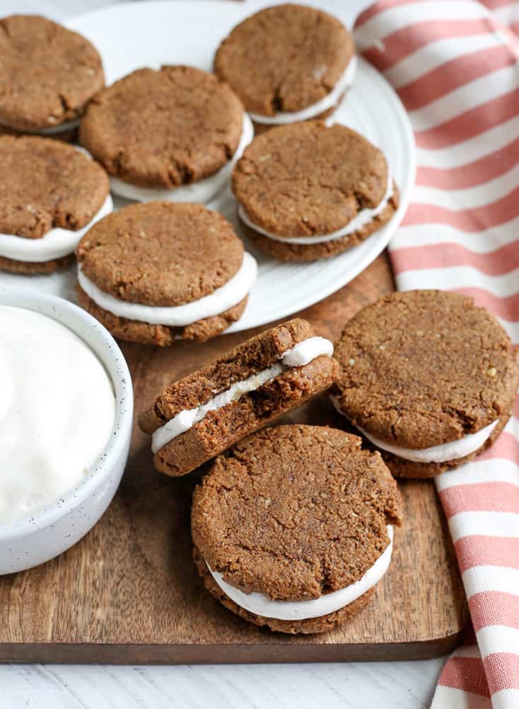 These Paleo Oatmeal Cream Pies contain no oatmeal, but still have the same taste and texture. A soft, sweet cookie with a marshmallow filling. Gluten free, dairy free, and naturally sweetened.