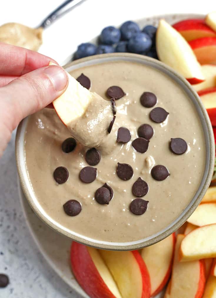 This Paleo SunButter Yogurt Fruit Dip is simple to make and so delicious. SunButter and dairy free yogurt combine to make a creamy dip that is perfect for pairing with fruit. It's vegan, naturally sweetened, and low FODMAP. 