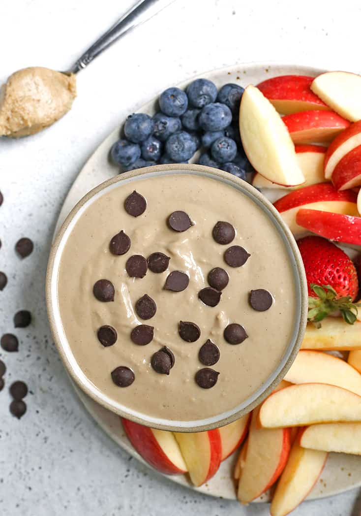 This Paleo SunButter Yogurt Fruit Dip is simple to make and so delicious. SunButter and dairy free yogurt combine to make a creamy dip that is perfect for pairing with fruit. It's vegan, naturally sweetened, and low FODMAP. 