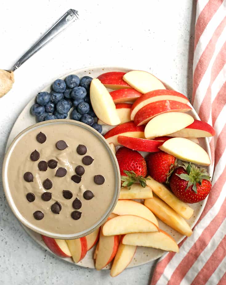 This Paleo SunButter Yogurt Fruit Dip is simple to make and so delicious. SunButter and dairy free yogurt combine to make a creamy dip that is perfect for pairing with fruit. It's vegan, naturally sweetened, and low FODMAP. 