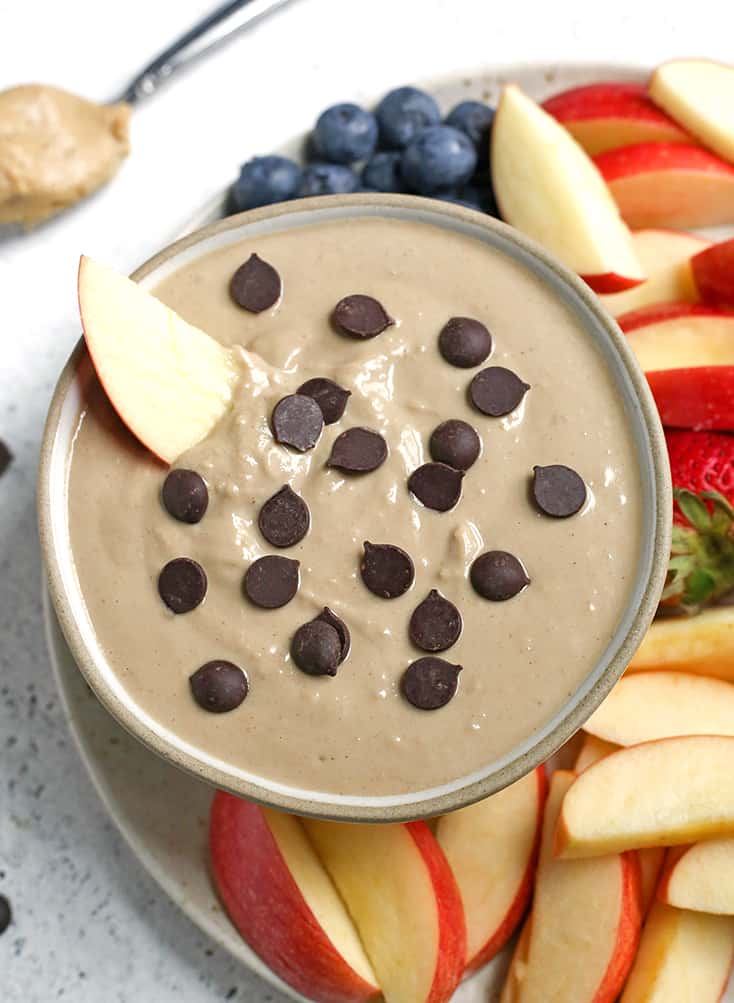 This Paleo SunButter Yogurt Fruit Dip is simple to make and so delicious. SunButter and dairy free yogurt combine to make a creamy dip that is perfect for pairing with fruit. It's vegan, naturally sweetened, and low FODMAP. 