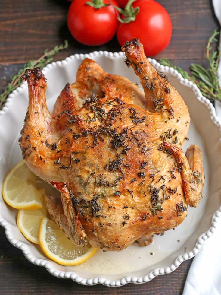 This Paleo Whole30 Air Fryer Whole Roasted Chicken is easy and incredibly delicious! Fresh herbs add great flavor and it has the best crispy skin. It's gluten free, dairy free, low carb and low FODMAP.