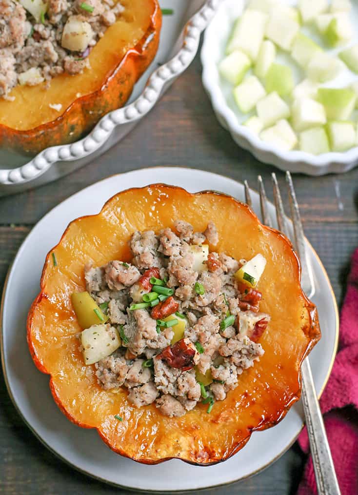 This Paleo Whole30 Sausage Stuffed Acorn Squash is filling, flavorful, and healthy. A homemade sausage, apples, and pecans stuffed into a tender acorn squash. Gluten free, dairy free, and can be made low FODMAP.