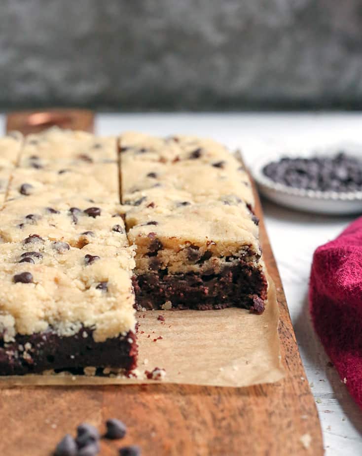 These Paleo Cookie Dough Topped Brownies are a decadent treat. Rich, fudgy brownies topped with an egg-free cookie dough. They are gluten free, dairy free, naturally sweetened and taste incredible!