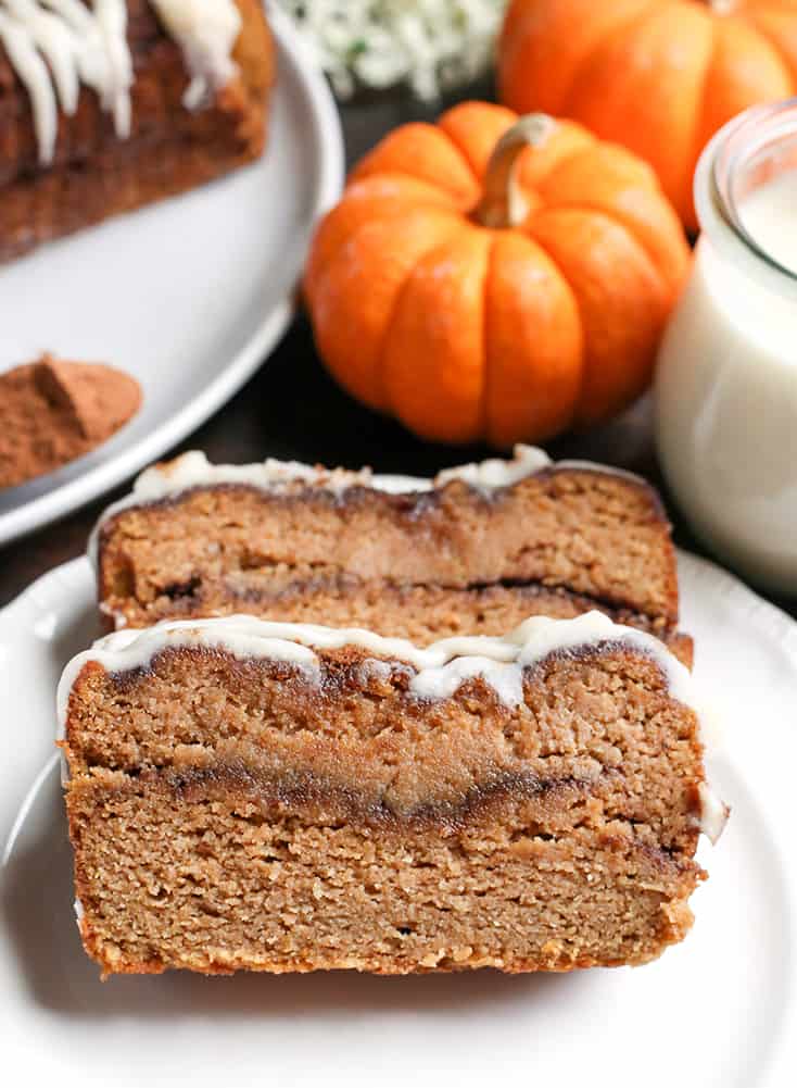 This Paleo Pumpkin Cinnamon Roll Bread is so easy to make and tastes incredible! Tender cake with a sweet pumpkin spice swirl and drizzled with a thick glaze. Gluten free, dairy free, and naturally sweetened.