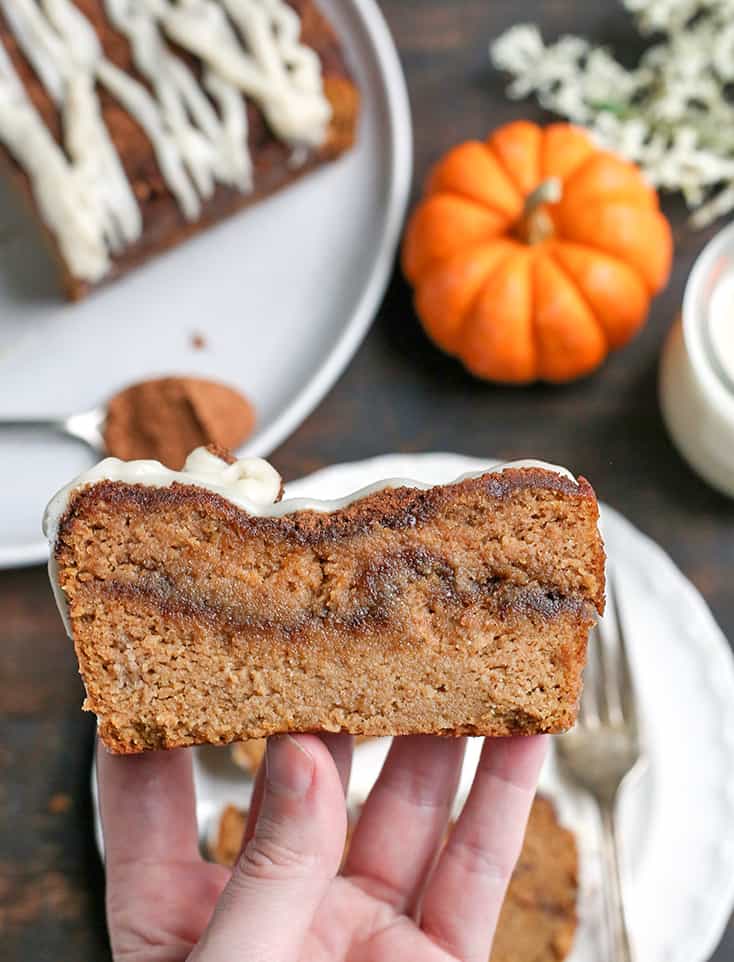 This Paleo Pumpkin Cinnamon Roll Bread is so easy to make and tastes incredible! Tender cake with a sweet pumpkin spice swirl and drizzled with a thick glaze. Gluten free, dairy free, and naturally sweetened.