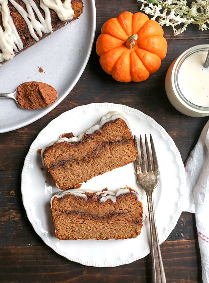 This Paleo Pumpkin Cinnamon Roll Bread is so easy to make and tastes incredible! Tender cake with a sweet pumpkin spice swirl and drizzled with a thick glaze. Gluten free, dairy free, and naturally sweetened.