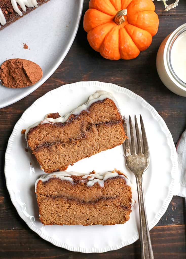 This Paleo Pumpkin Cinnamon Roll Bread is so easy to make and tastes incredible! Tender cake with a sweet pumpkin spice swirl and drizzled with a thick glaze. Gluten free, dairy free, and naturally sweetened.