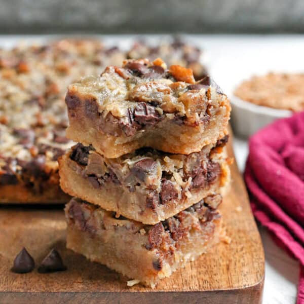 Paleo Magic Cookie Bars stacked in three