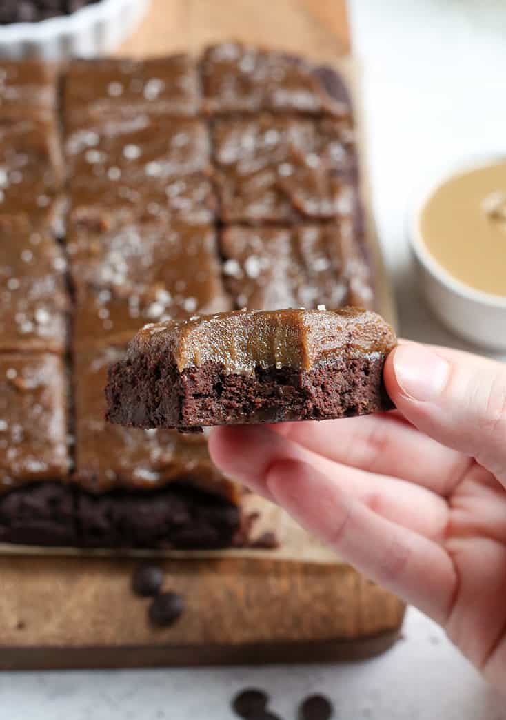 These Paleo Salted Caramel Brownies are a rich treat that everyone will love! A simple, fudgy brownie topped with a thick layer of dairy free caramel. They are nut free, gluten free, dairy free, and naturally sweetened.