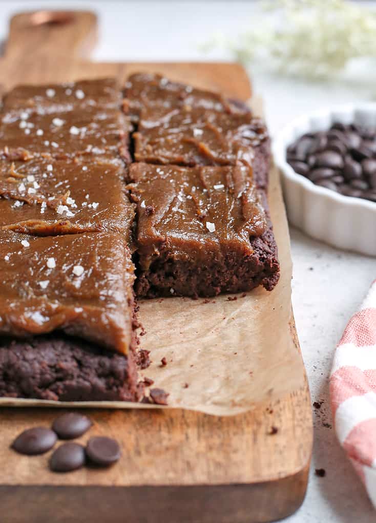 These Paleo Salted Caramel Brownies are a rich treat that everyone will love! A simple, fudgy brownie topped with a thick layer of dairy free caramel. They are nut free, gluten free, dairy free, and naturally sweetened.
