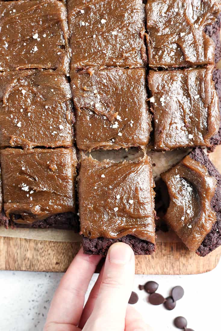 These Paleo Salted Caramel Brownies are a rich treat that everyone will love! A simple, fudgy brownie topped with a thick layer of dairy free caramel. They are nut free, gluten free, dairy free, and naturally sweetened.