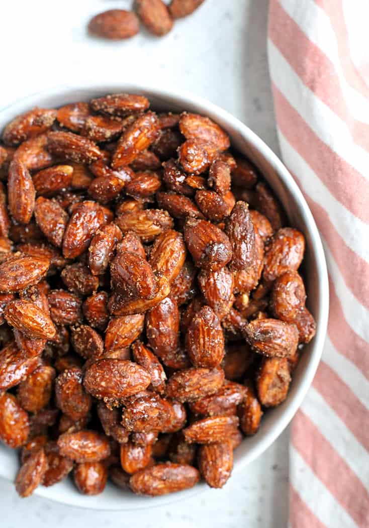 These Paleo Vegan Cinnamon Candied Almonds are sweet, crunchy, and so delicious! A great snack or treat that is gluten free, dairy free, egg free and naturally sweetened.