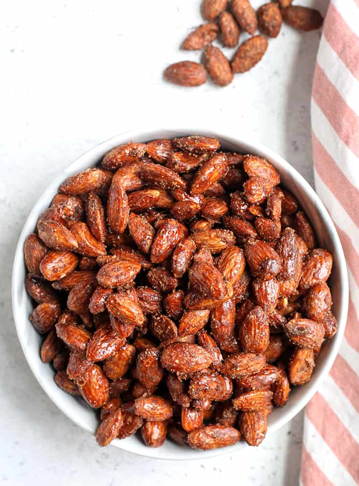 These Paleo Vegan Cinnamon Candied Almonds are sweet, crunchy, and so delicious! A great snack or treat that is gluten free, dairy free, egg free and naturally sweetened.