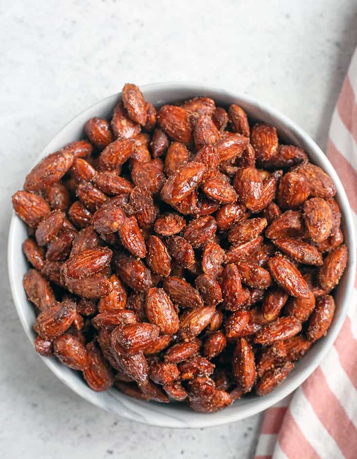 These Paleo Vegan Cinnamon Candied Almonds are sweet, crunchy, and so delicious! A great snack or treat that is gluten free, dairy free, egg free and naturally sweetened.