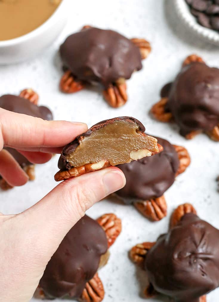 These Paleo Vegan Pecan Turtles are simple to make, no-bake, and so tasty. A healthy version of the classic candy. Sweet caramel on top of crunchy pecans and topped with chocolate. They are gluten free, dairy free, low FODMAP and naturally sweetened. 