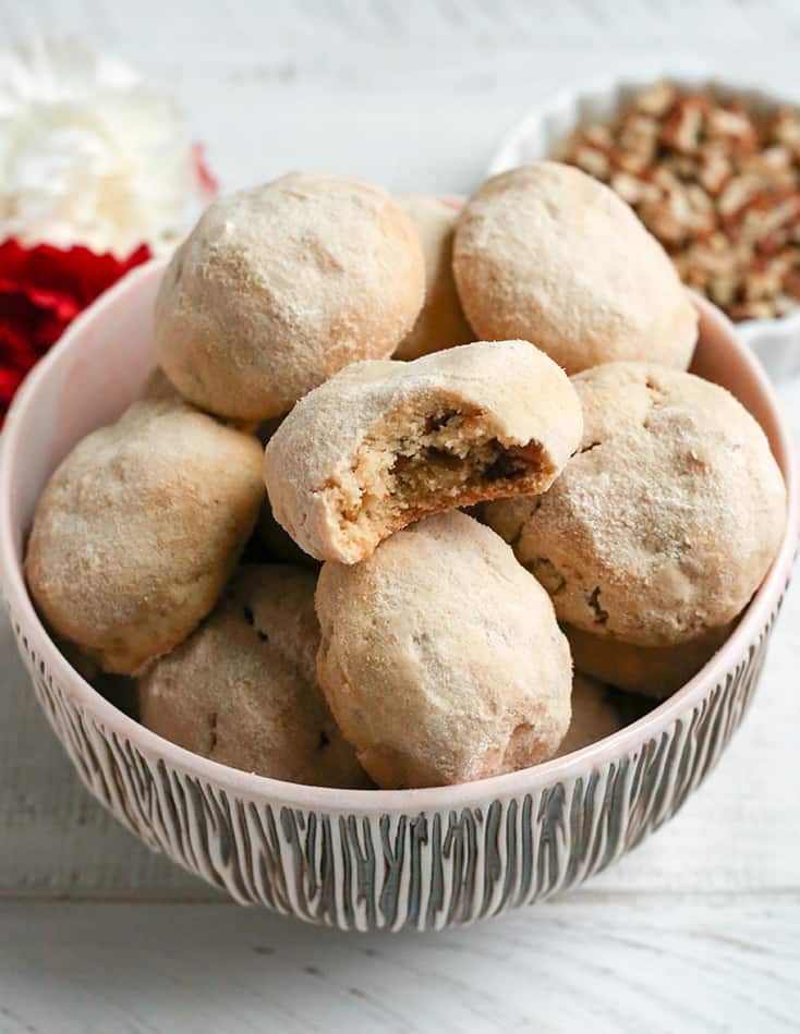 These Paleo Mexican Wedding Cookies also known as snow ball cookies or Russian Tea Cakes, are tender, sweet and so delicious! A crumbly cookie, packed with pecans, rolled in homemade powdered sugar. They are gluten free, dairy free, and naturally sweetened.