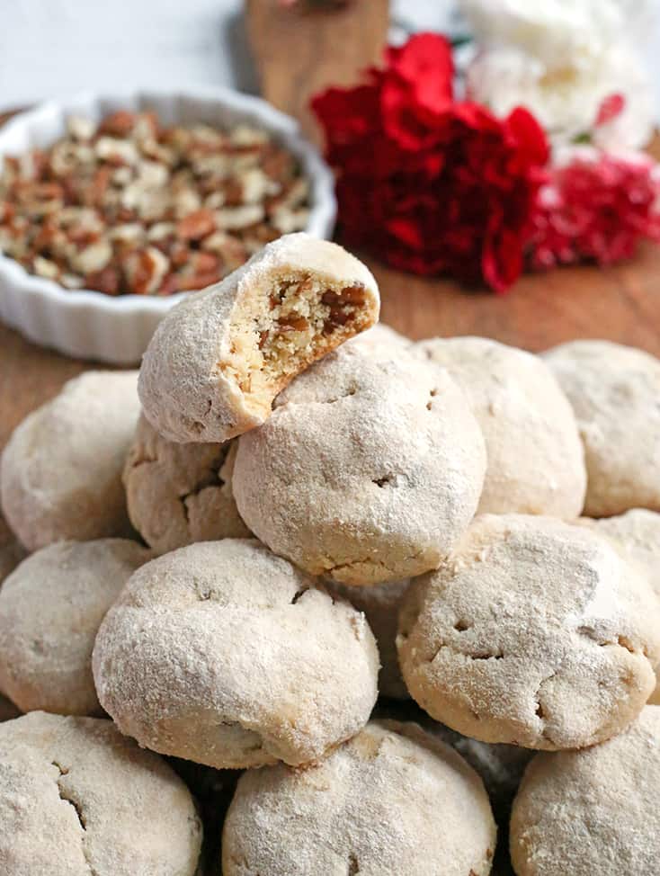 These Paleo Mexican Wedding Cookies also known as snow ball cookies or Russian Tea Cakes, are tender, sweet and so delicious! A crumbly cookie, packed with pecans, rolled in homemade powdered sugar. They are gluten free, dairy free, and naturally sweetened.