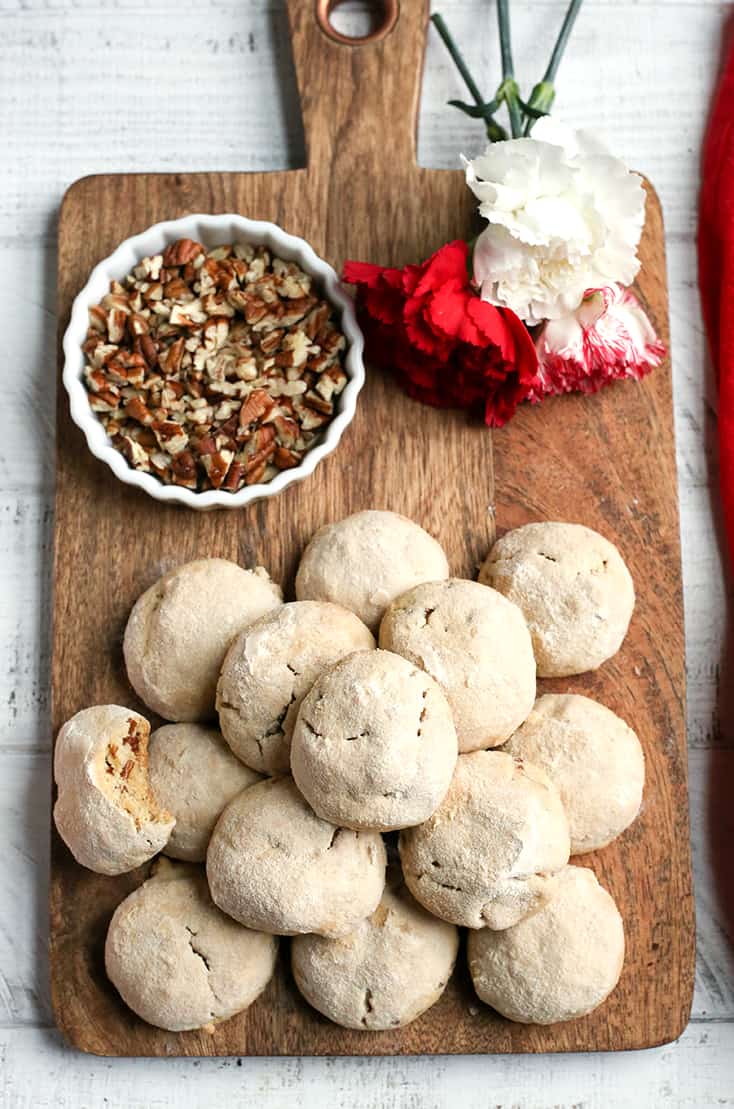 These Paleo Mexican Wedding Cookies also known as snow ball cookies or Russian Tea Cakes, are tender, sweet and so delicious! A crumbly cookie, packed with pecans, rolled in homemade powdered sugar. They are gluten free, dairy free, and naturally sweetened.