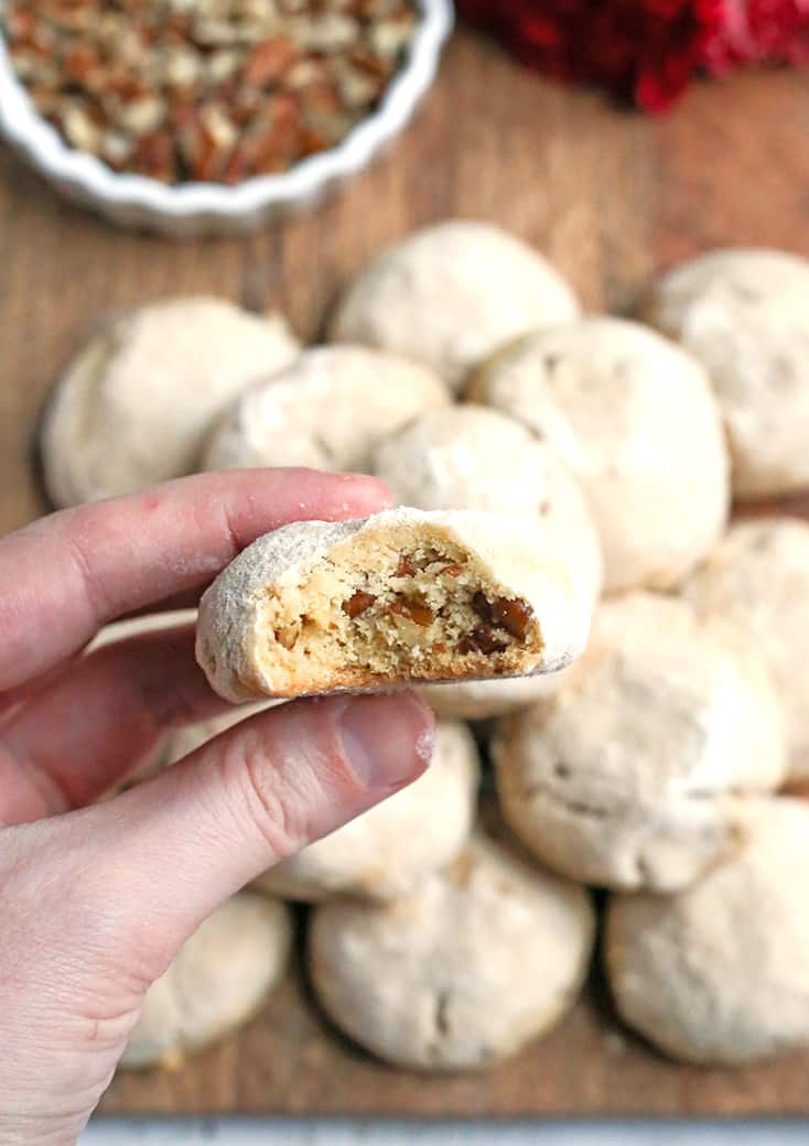 These Paleo Mexican Wedding Cookies also known as snow ball cookies or Russian Tea Cakes, are tender, sweet and so delicious! A crumbly cookie, packed with pecans, rolled in homemade powdered sugar. They are gluten free, dairy free, and naturally sweetened.