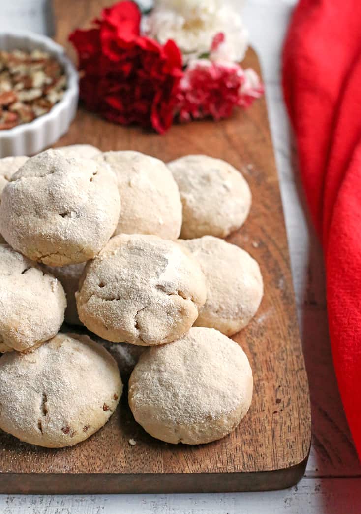 These Paleo Mexican Wedding Cookies also known as snow ball cookies or Russian Tea Cakes, are tender, sweet and so delicious! A crumbly cookie, packed with pecans, rolled in homemade powdered sugar. They are gluten free, dairy free, and naturally sweetened.