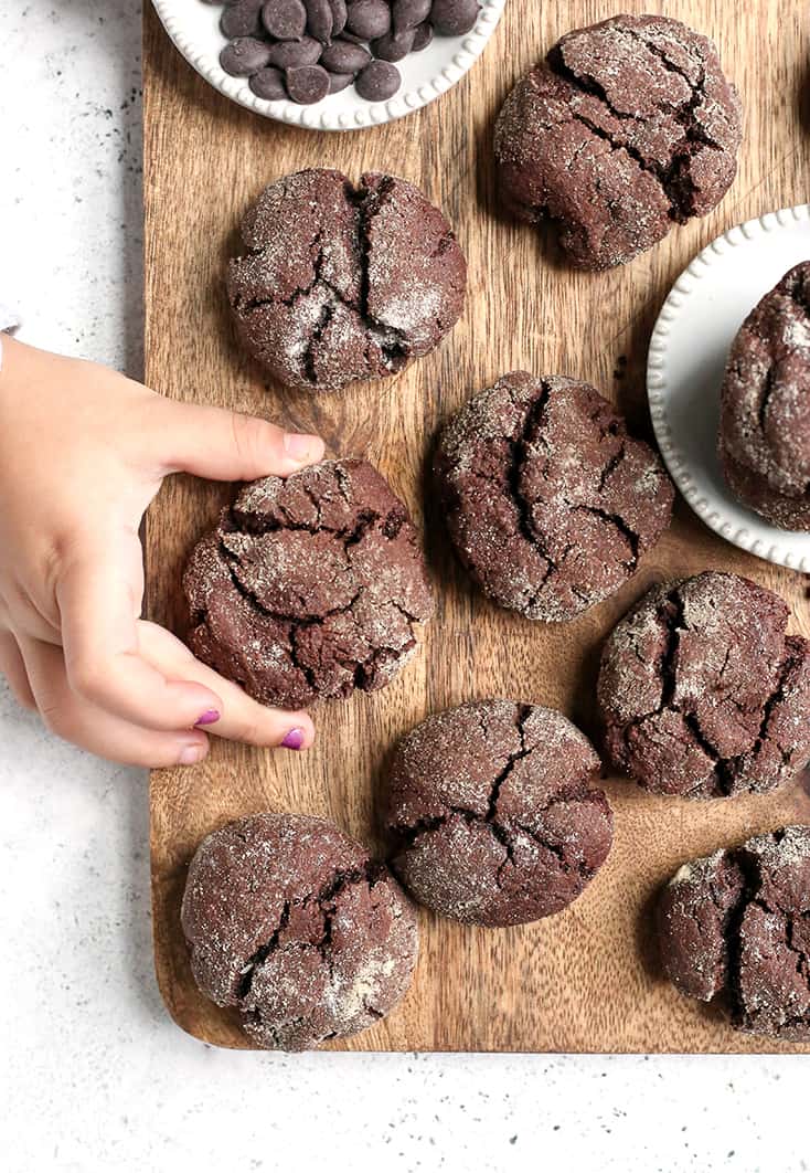 These Paleo Chocolate Crinkle Cookies are rich, thick and so delicious! Gluten free, dairy free, and naturally sweetened.