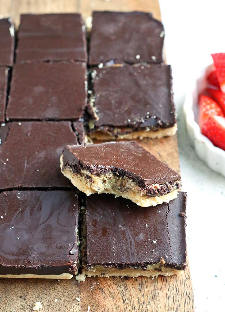 These Paleo Nut Free Tagalong Bars are simple to make and so delicious. A shortbread crust, sweet SunButter layer, and topped with chocolate. They are vegan, gluten free, dairy free, and naturally sweetened.