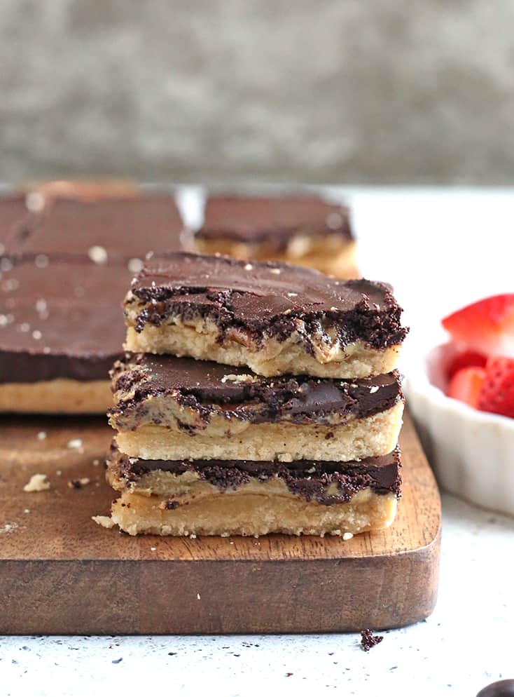 These Paleo Nut Free Tagalong Bars are simple to make and so delicious. A shortbread crust, sweet SunButter layer, and topped with chocolate. They are vegan, gluten free, dairy free, and naturally sweetened.